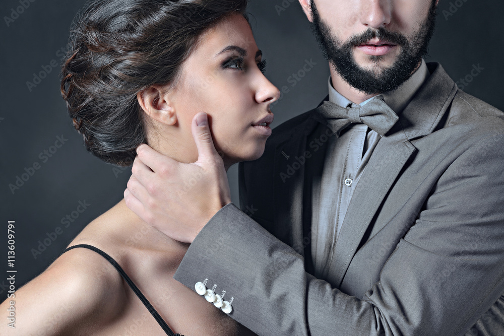 Beautiful lady in bra with handsome guy in suit. Young couple is hugging each other. Portrait of girl in underwear and boy indoors in passionate pose. Beauty woman with attractive lace lingerie Beautiful lady in bra with handsome guy in suit. Young couple is hugging each other. Portrait of girl in underwear and boy indoors in passionate pose. Beauty woman with attractive lace lingerie