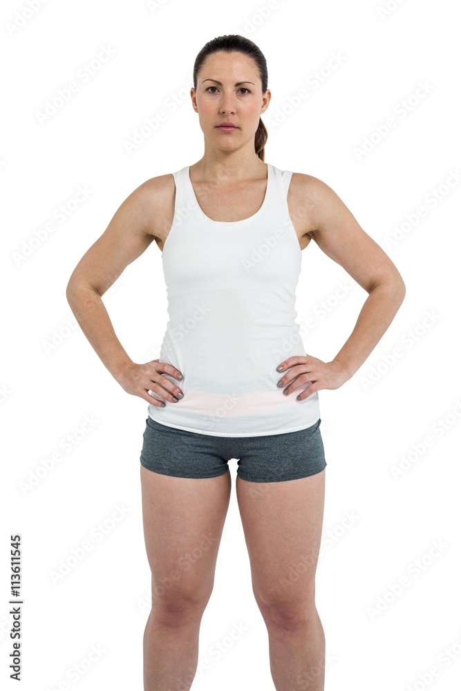 Portrait of female athlete standing with hands on hips Portrait of female athlete standing with hands on hips