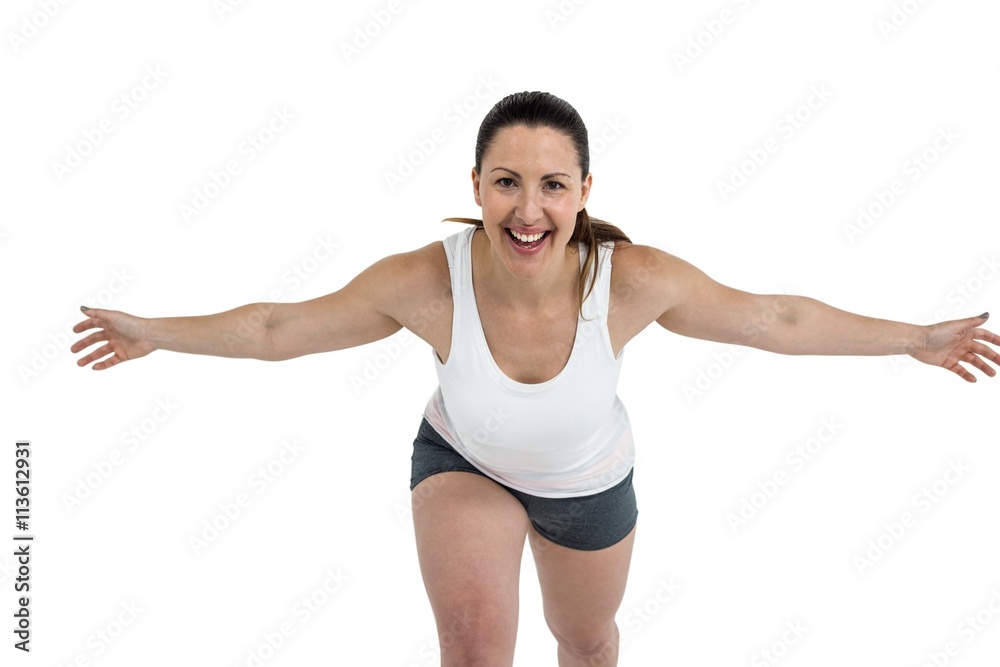 Female athlete posing on white background