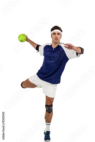 Portrait of sportsman throwing a ball