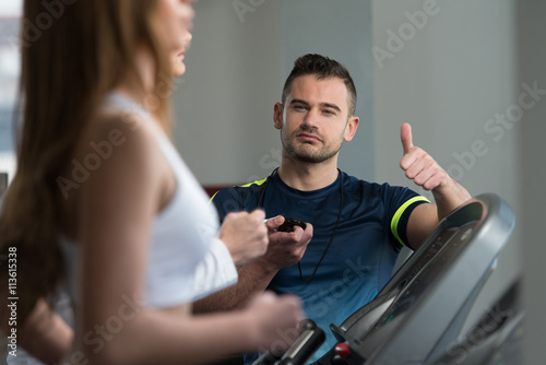 Personal Trainer Showing Ok Sign To Client © Jale Ibrak