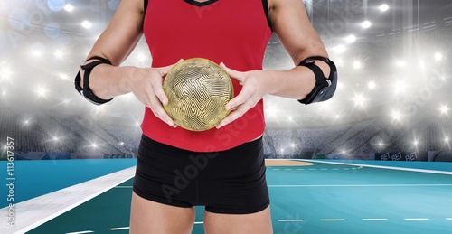 Composite image of female athlete with elbow pad holding handball