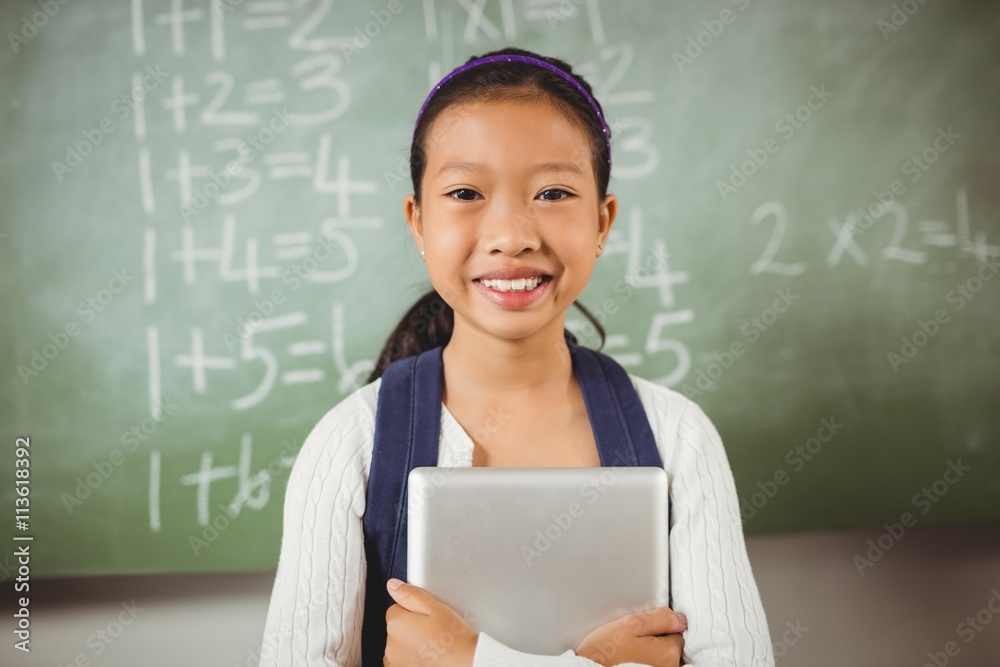 Smiling schoolgirl looking at the camera