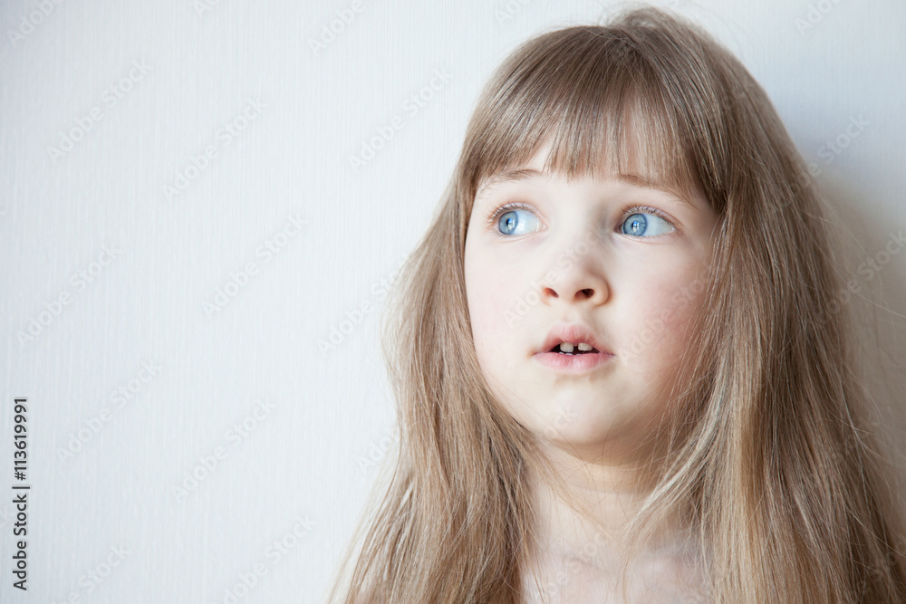 Portrait of a pretty little girl with opened eyes wide Portrait of a pretty little girl with opened eyes wide
