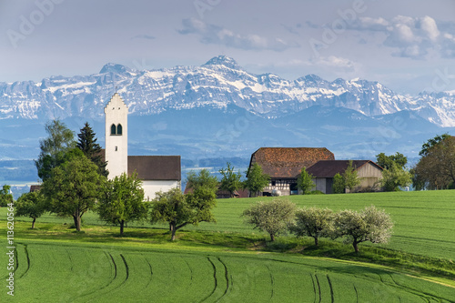 Germany, Lake Constance district, St. Michael's Church near Ueberlingen, Swiss Alps with Saentis in the background photo