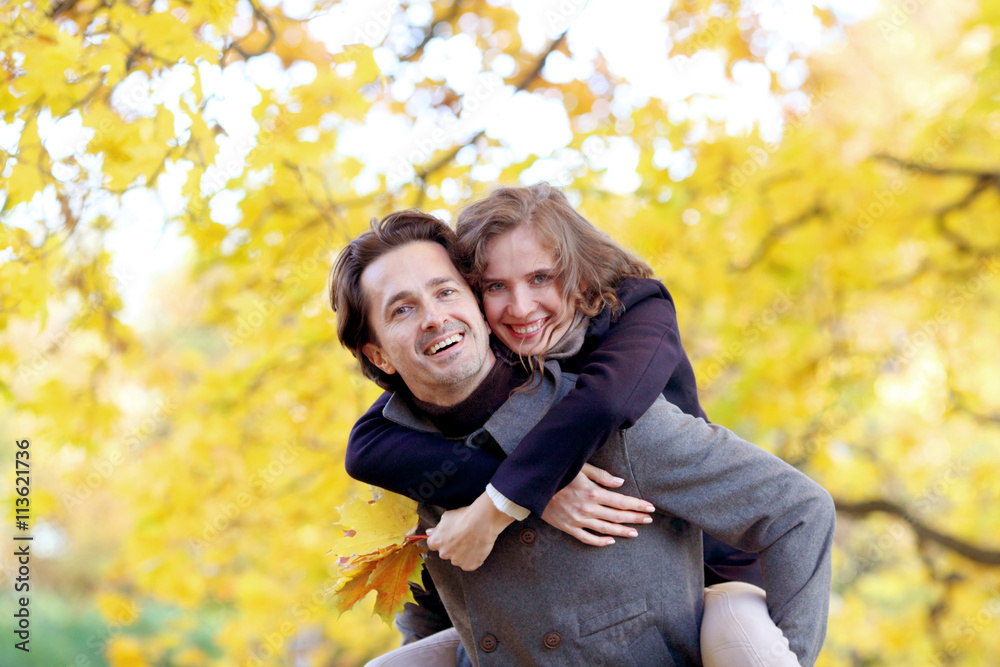 Couple hugging in autumn park Couple hugging in autumn park