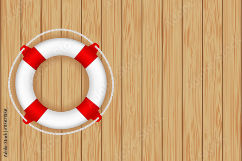 Lifesaving buoy on wooden background