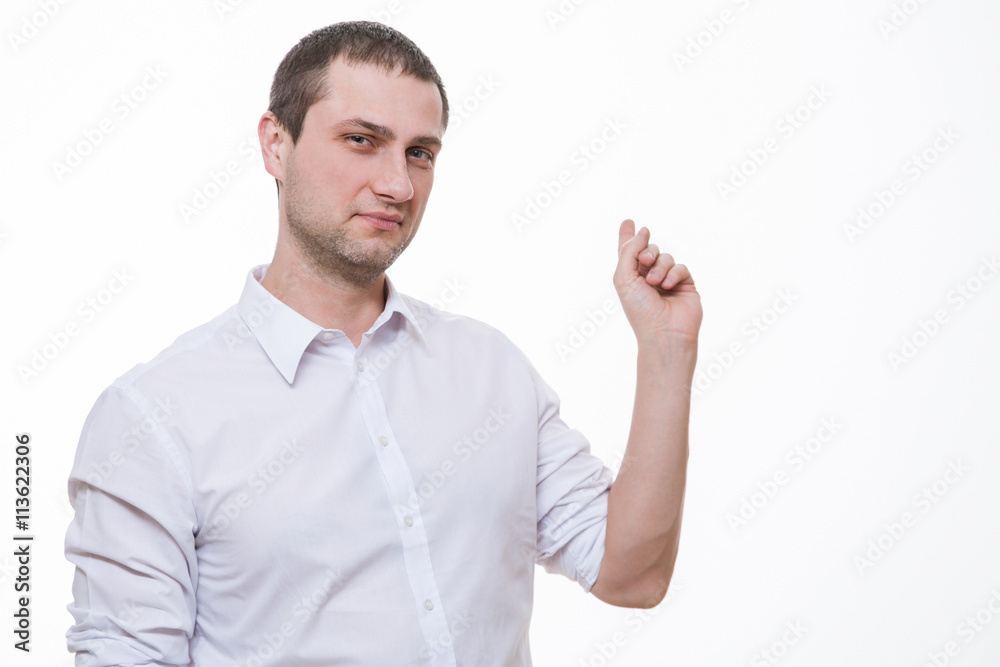 Attractive young businessman indicating something Attractive young businessman indicating something