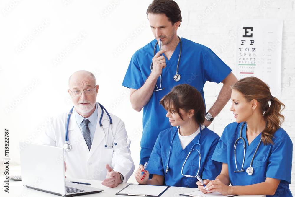 Medical doctors team using computer Medical doctors team using computer
