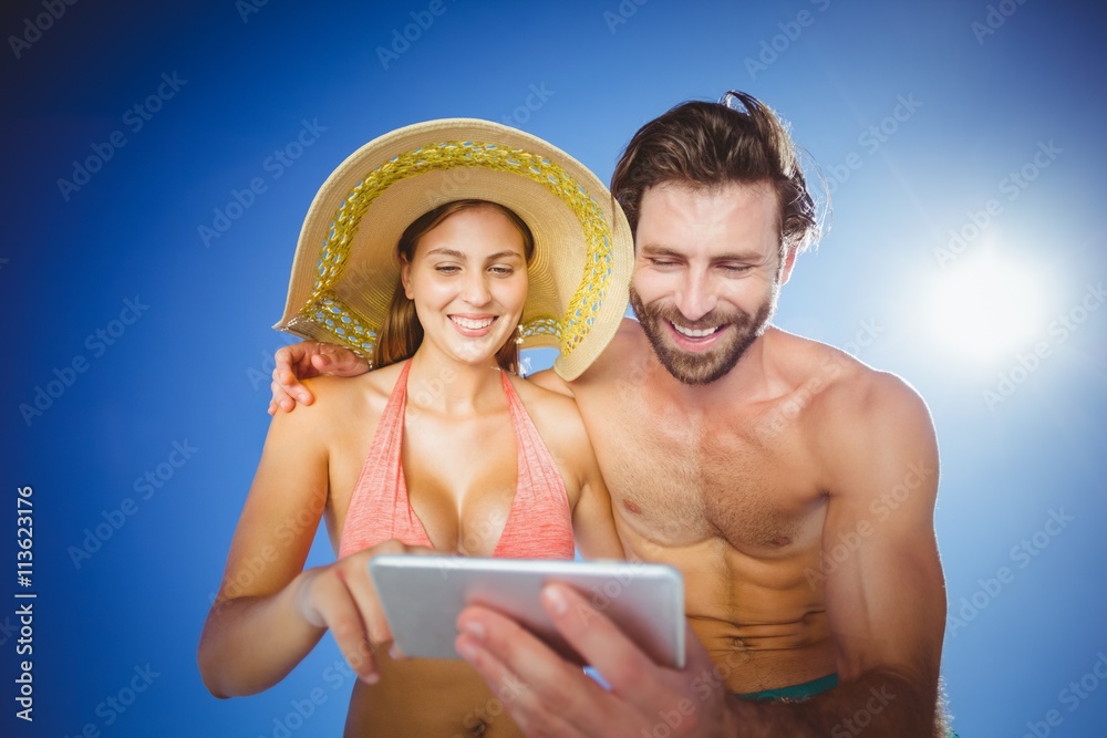 Couple using mobile phone on a sunny day