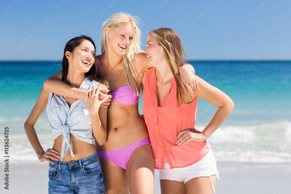 Young female friends enjoying on beach Young female friends enjoying on beach