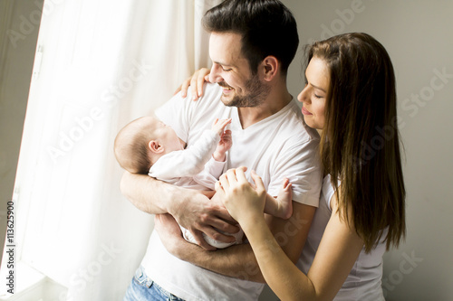 Happy family by the window