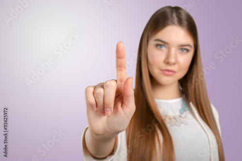 Young elegant woman pointing