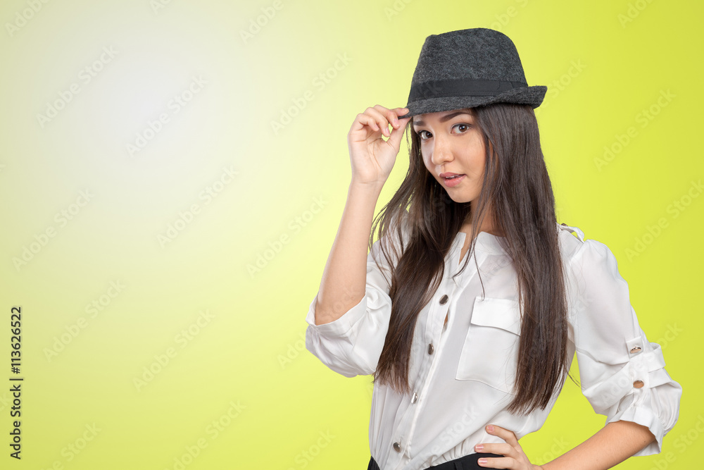 Beautiful young woman wearing summer fedora straw hat posing Beautiful young woman wearing summer fedora straw hat posing