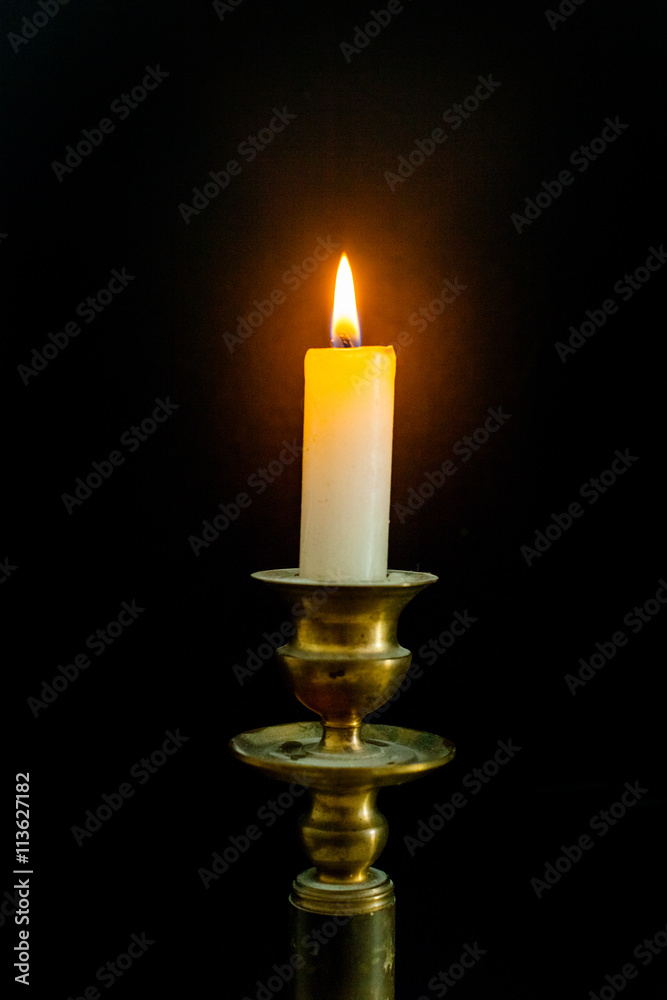 Retro style candle holder with lighted candle Retro style candle holder with lighted candle