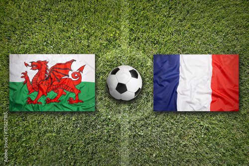 Wales vs. France flags on soccer field