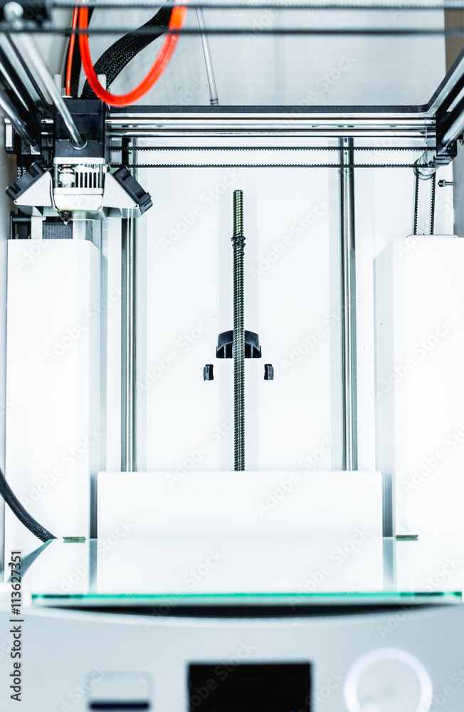 3d printer with bright red filament. 3d printer with bright red filament.