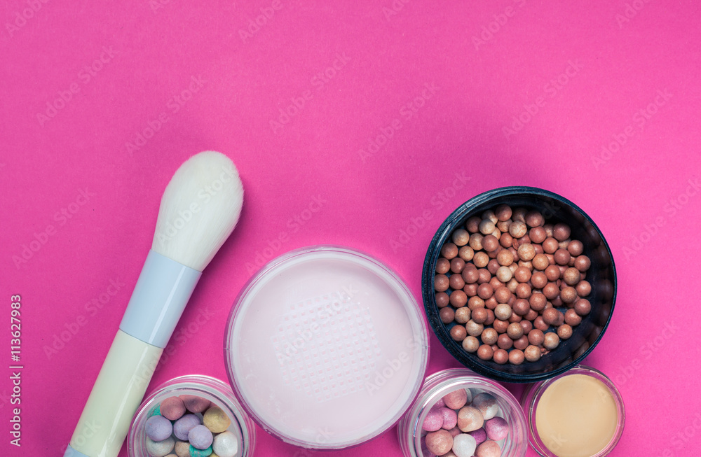 Set of colorful cosmetics on pink table Set of colorful cosmetics on pink table