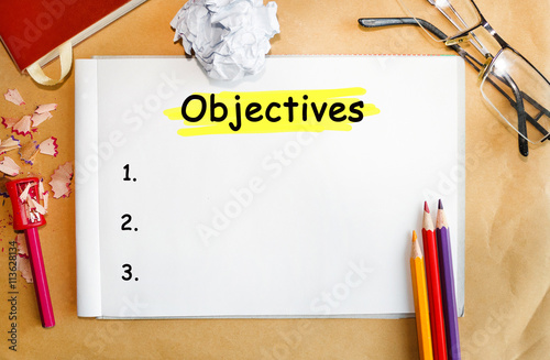Notebook with Tools and Notes About Objectives photo
