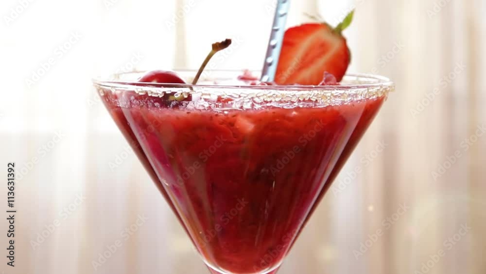 Strawberry cocktail with ice in a glass Strawberry cocktail with ice in a glass