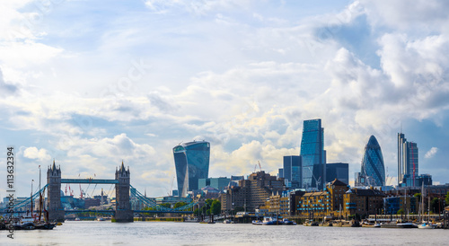 Canvas Print Stunning London cityscape with Tower Bridge against a sky with dramatic clouds