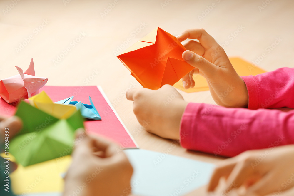 Children making swan with coloured paper Children making swan with coloured paper