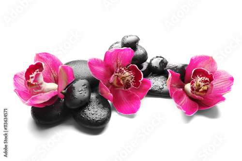 Spa stones and red orchid isolated on white