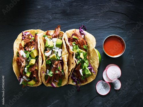 Photo three mexican pork carnitas tacos flat lay composition