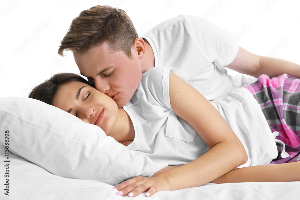 Couple in bed, isolated on white Couple in bed, isolated on white