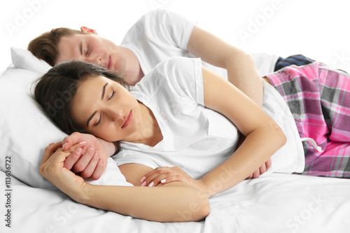 Couple in bed, isolated on white