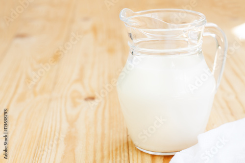 Glass jug with milk