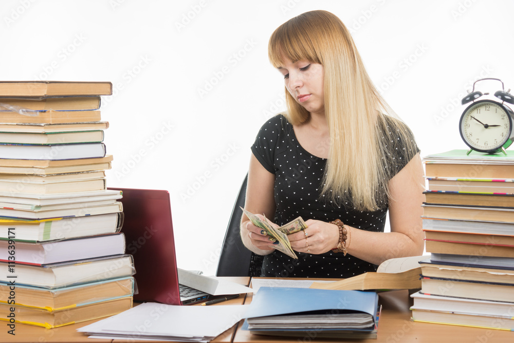 The student considers the amount of bribes to pass the exam The student considers the amount of bribes to pass the exam
