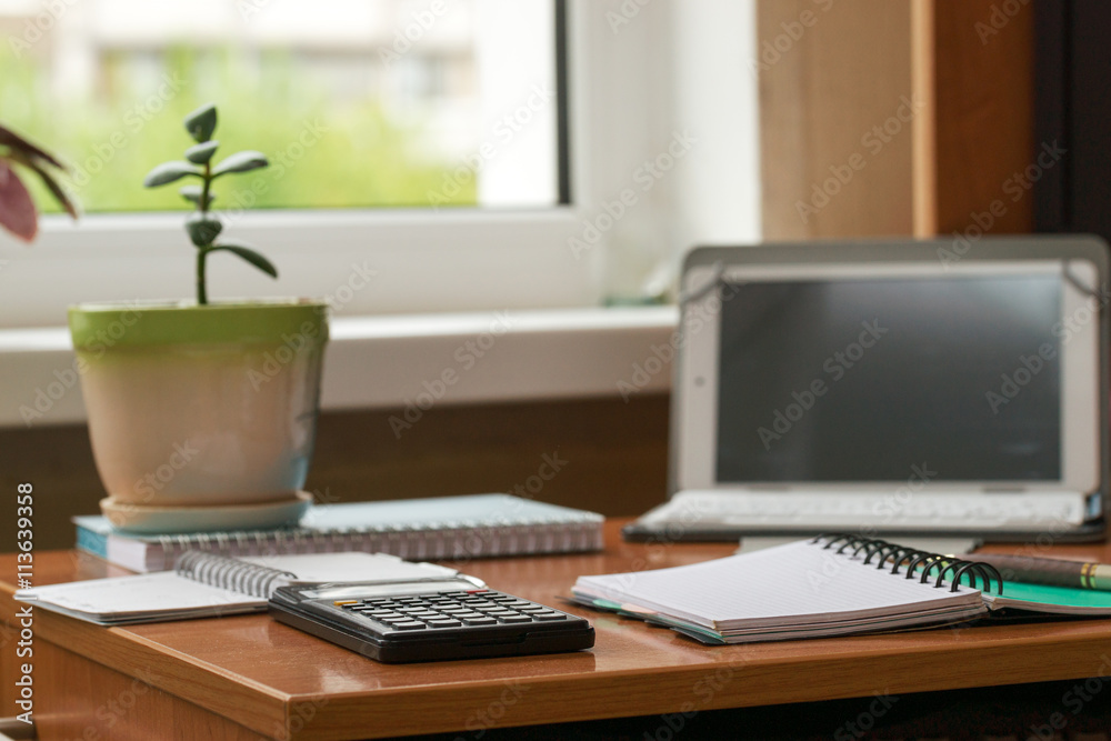 Fototapeta premium Office desk table with computer, supplies, flower. Copy space for text