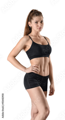 Portrait of slim muscled young girl posing for the camera.