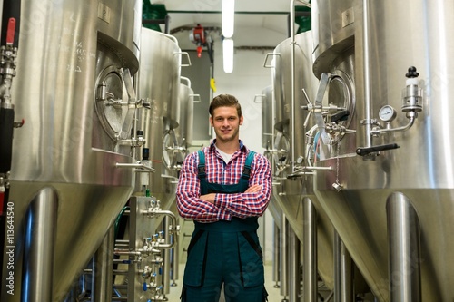 Brewer with arms crossed at brewery