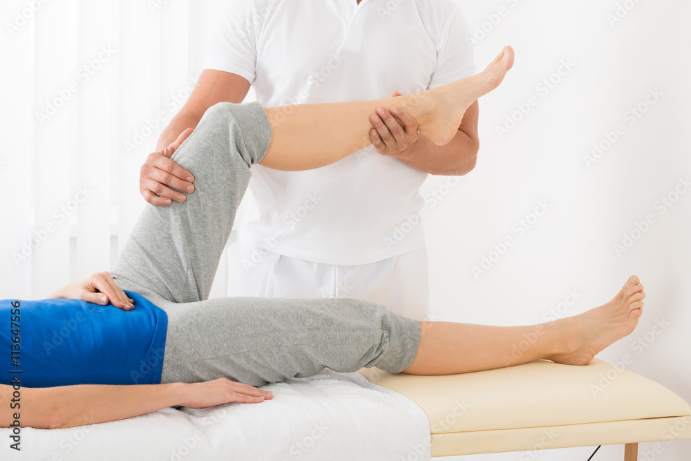 Masseur Giving Leg Massage To Woman Stock Foto Adobe Stock
