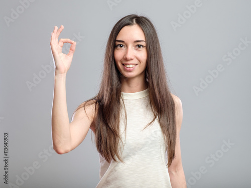 Girl showing OK sign