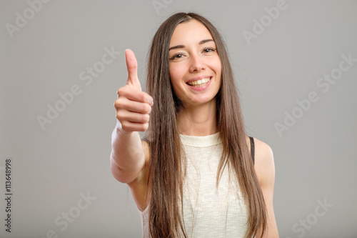 Girl showing thumb up