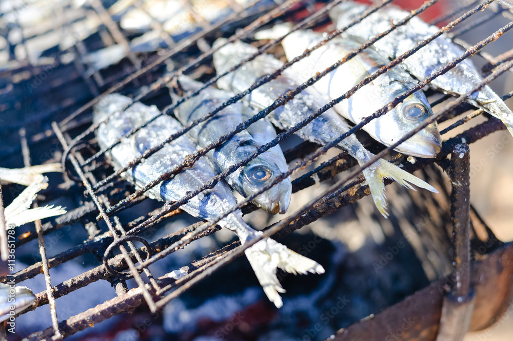 Closeup on fish in a grill