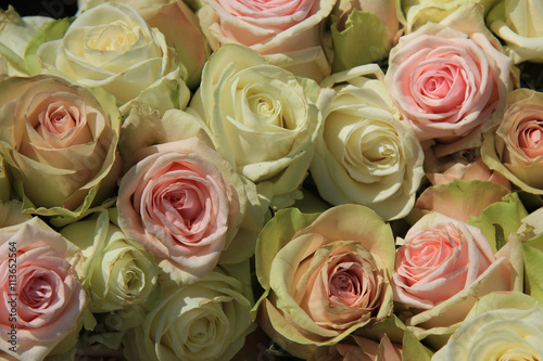 White and Pink roses in wedding arrangement