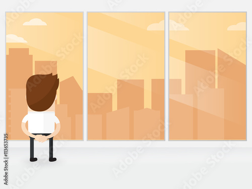 businessman or manager looking out of big window watching skyline with a great city view