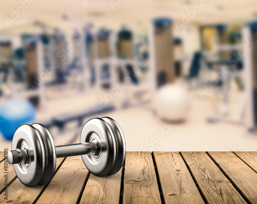 metal dumbbell with gym background