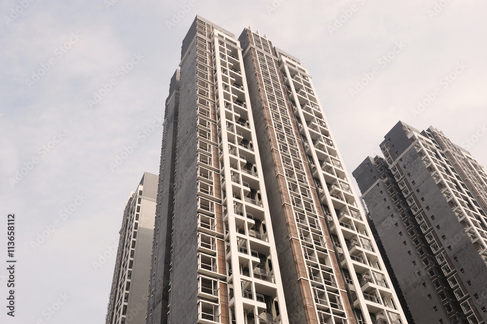 Fototapeta premium low angle view of modern apartment skyscraper