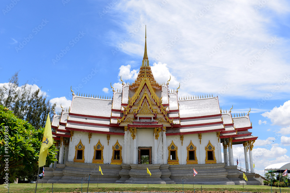 Fototapeta premium Beautiful Thai sculpture temple and and Blue sky with Clouds background.