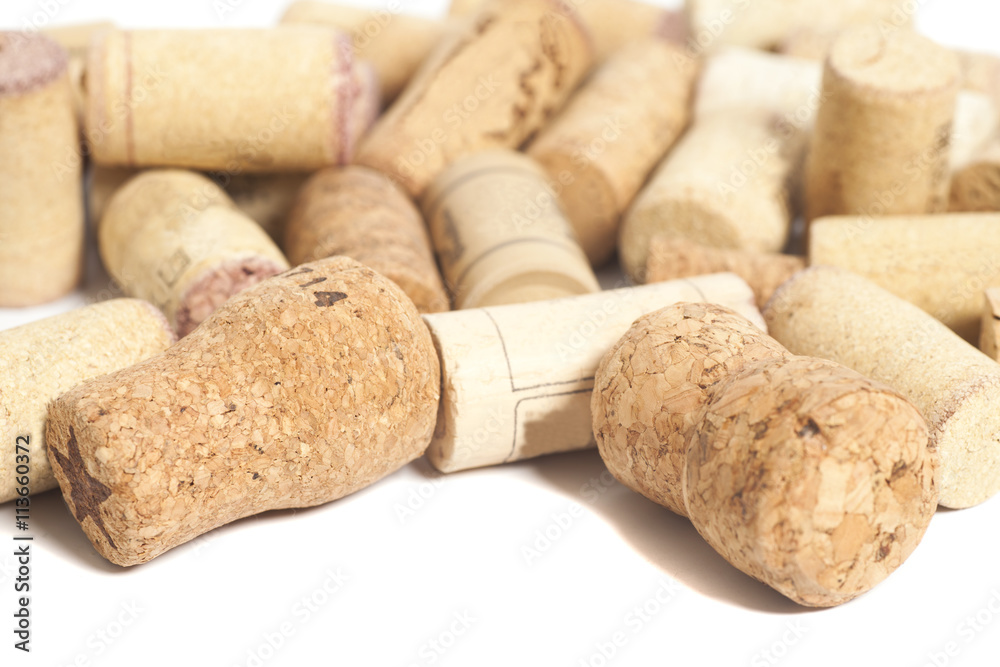 close-ups of wine corks on white background
