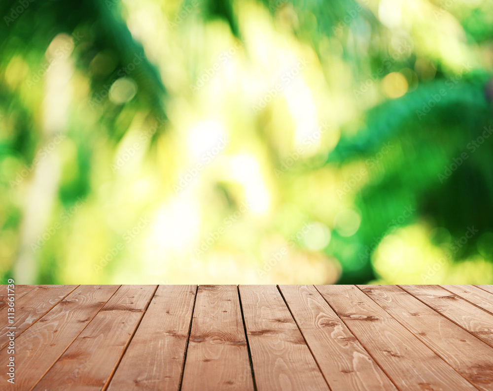 Abstract nature bokeh background and empty wood table