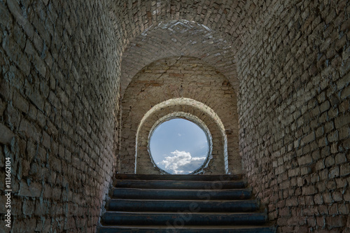 Light at end of the tunnel in a positive thinking concept a way to the heaven .