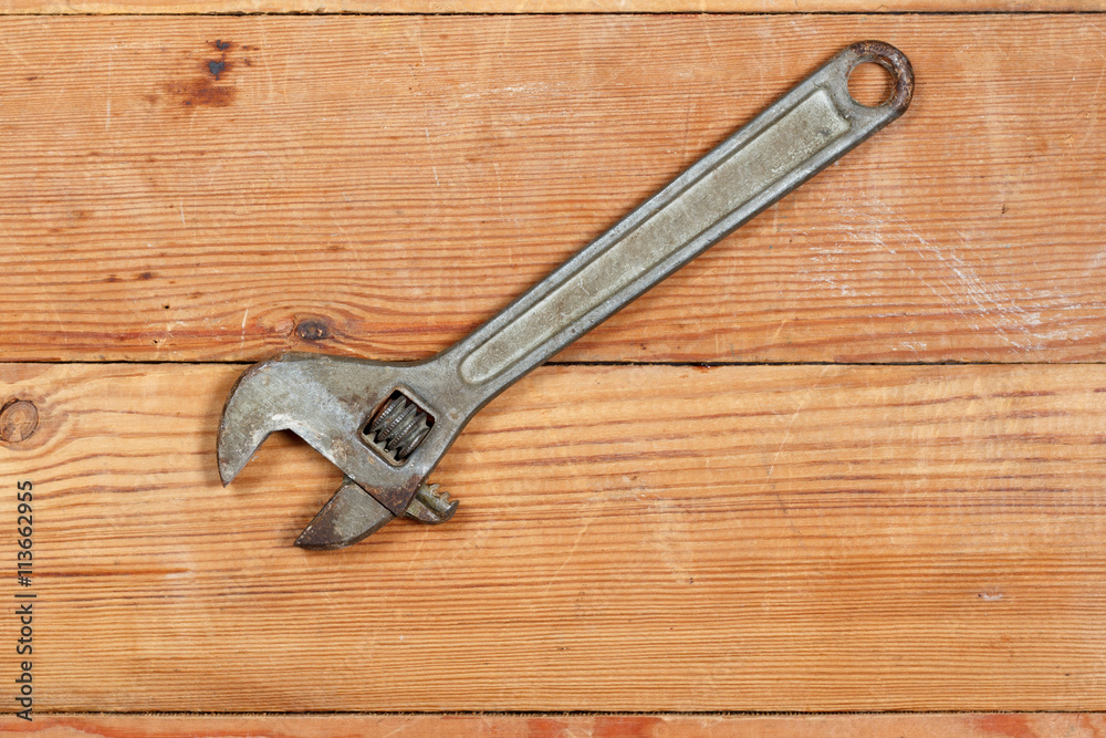 adjustable spanner on the boards. top view adjustable spanner on the boards. top view