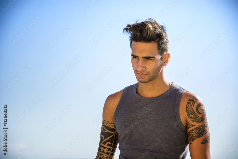 Young Man at Beach in Sunny Summer Day Young Man at Beach in Sunny Summer Day