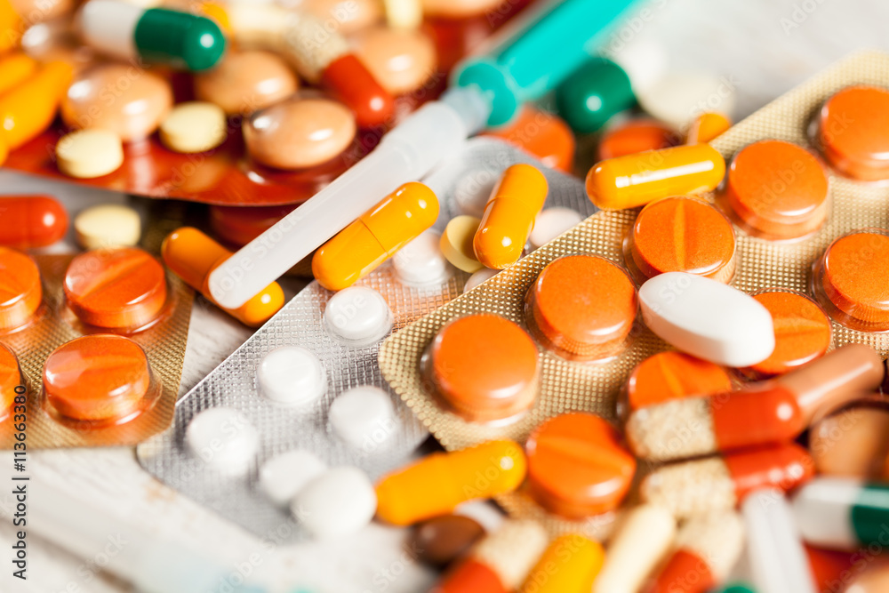 Medicine prescription. Pills and antibiotic in blurred backgroun Medicine prescription. Pills and antibiotic in blurred backgroun